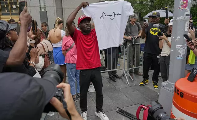 A supporter of Sean "Diddy" Combs, reacts outside Manhattan federal court after Combs' was convicted of a prostitution-related offense but acquitted on the most serious charges at his New York trial, Wednesday, July 2, 2025, in New York. (AP Photo/Yuki Iwamura)