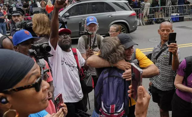 Spporters of Sean "Diddy" Combs, react outside Manhattan federal court after Combs was convicted of a prostitution-related offense but acquitted on the most serious charges at his New York trial, Wednesday, July 2, 2025, in New York. (AP Photo/Yuki Iwamura)