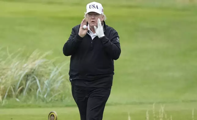 President Donald Trump gestures as he plays golf at the Trump Turnberry golf course in Turnberry, Scotland, Sunday, July 27, 2025.(AP Photo/Alastair Grant)