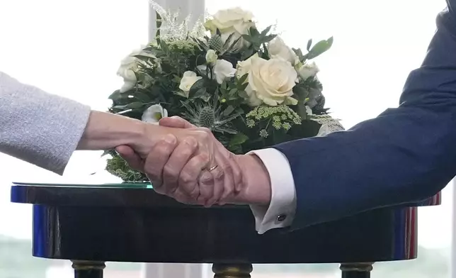President Donald Trump and European Commission President Ursula von der Leyen shake hands after reaching a trade deal at the Trump Turnberry golf course in Turnberry, Scotland Sunday, July 27, 2025. (AP Photo/Jacquelyn Martin)