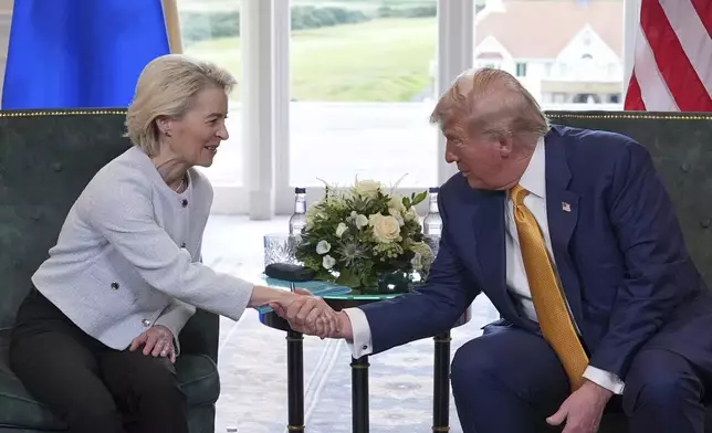 President Donald Trump shakes hands with European Commission President Ursula von der Leyen as they meet at the Trump Turnberry golf course in Turnberry, Scotland Sunday, July 27, 2025. (AP Photo/Jacquelyn Martin)