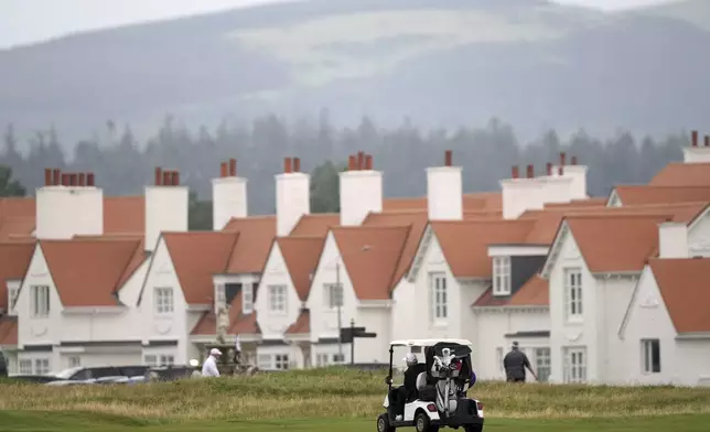 President Donald Trump steers a golf cart at the Trump Turnberry golf course in Turnberry, Scotland, Sunday, July 27, 2025.(AP Photo/Alastair Grant)