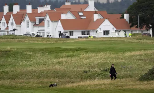 Police forces with dogs search the area at the Trump Turnberry golf course in Turnberry, Scotland, Saturday, July 26, 2025 as President Donald Trump begins his five-day private trip to the country.(AP Photo/Alastair Grant)