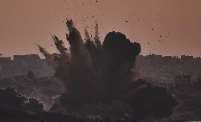Smoke rises to the sky following an Israeli airstrike in the Gaza Strip, as seen from southern Israel , Friday, July 18, 2025. (AP Photo/Leo Correa)