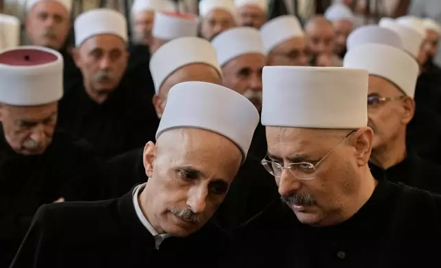 Druze clerics take part in a gathering of minority religious leaders in Beirut, Lebanon, Friday, July 18, 2025, as they speak about sectarian clashes between Druze factions, Sunni Muslim Bedouin clans, and government forces in Syria. (AP Photo/Bilal Hussein)