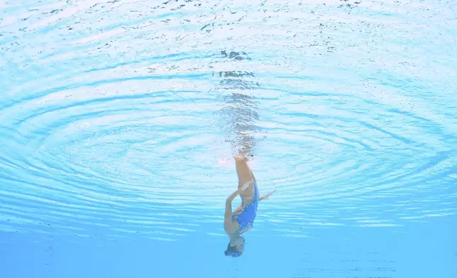 Mia Piri of Croatia competes in the women's solo technical preliminary of artistic swimming at the World Aquatics Championships in Singapore, Friday, July 18, 2025. (AP Photo/Lee Jin-man)