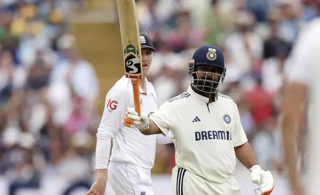 India's Rishabh Pant celebrates after scoring fifty runs on day four of the second cricket test match between England and India at Edgbaston in Birmingham, England, Saturday, July 5, 2025. (AP Photo/Scott Heppell)
