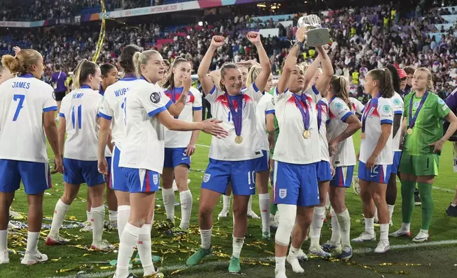 England's Lucy Bronze celebrates with the trophy after winning the Women's Euro 2025 final soccer match between England and Spain at St. Jakob-Park in Basel, Switzerland, Sunday, July 27, 2025. (AP Photo/Alessandra Tarantino)