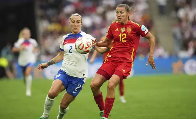 England's Maya Le Tissier, right, vies for the ball with England's Lucy Bronze during the Women's Euro 2025 final soccer match between England and Spain at St. Jakob-Park in Basel, Switzerland, Sunday, July 27, 2025. (AP Photo/Alessandra Tarantino)