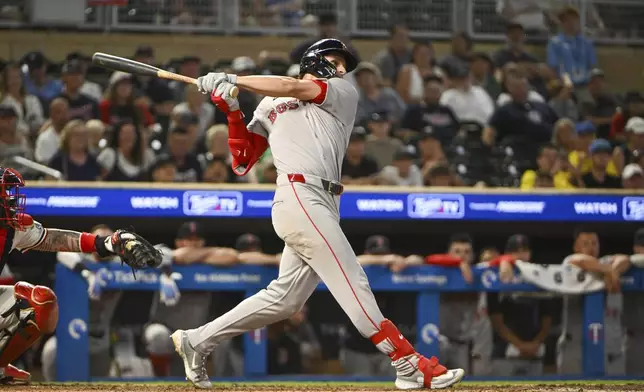 Boston Red Sox's Roman Anthony hits an RBI single to center field against Minnesota Twins pitcher Jhoan Duran during the ninth inning of a baseball game, Monday, July 28, 2025, in Minneapolis. David Hamilton scored. (AP Photo/Craig Lassig)