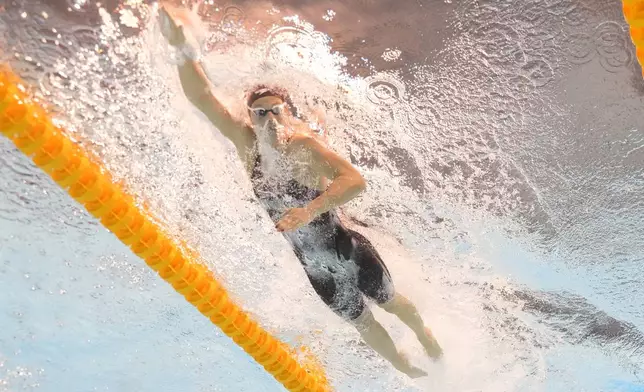 Summer Mcintosh of Canada competes in the women's 200-meter individual medley heat at the World Aquatics Championships in Singapore, Sunday, July 27, 2025. (AP Photo/Lee Jin-man)