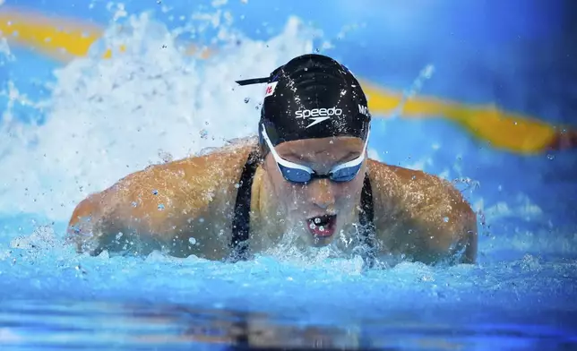 Summer Mcintosh of Canada competes in the women's 200-meter individual medley heat at the World Aquatics Championships in Singapore, Sunday, July 27, 2025. (AP Photo/Vincent Thian)