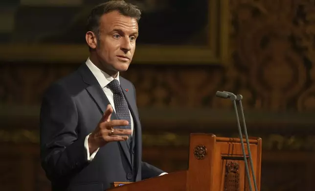 French President Emmanuel Macron addresses parliament in the Palace of Westminster, London, Tuesday, July 8, 2025.(AP Photo/Alastair Grant, Pool)