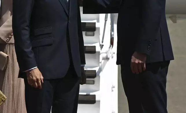 France's President Emmanuel Macron, with his wife Brigitte Macron, are greeted by Britain's Prince William, right, and Kate, Princess of Wales at RAF Northolt, west of London, Tuesday July 8, 2025, on the first day of a three-day state visit to Britain. (Justin Tallis/Pool via AP)