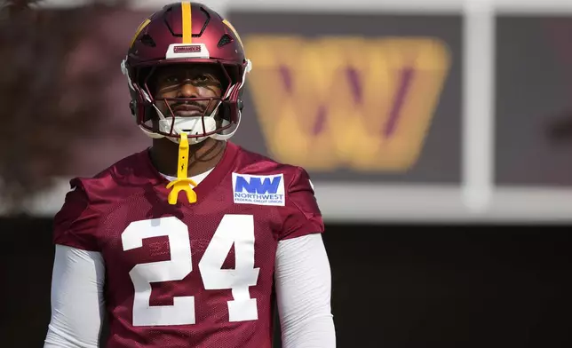 Washington Commanders linebacker Von Miller (24) arrives for practice at the team's NFL football training camp, Wednesday, July 23, 2025, in Ashburn, Va. (AP Photo/Mark Schiefelbein)