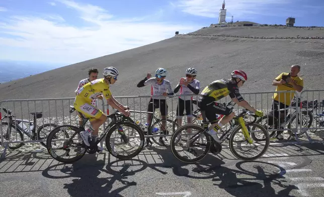 Slovenia's Tadej Pogacar, wearing the overall leader's yellow jersey, follows Denmark's Jonas Vingegaard during the last kilometers of the sixteenth stage of the Tour de France cycling race over 171.5 kilometers (106.6 miles) with start in Montpellier and finish on the Mont Ventoux, France, Tuesday, July 22, 2025. (Bernard Papon/Pool Photo via AP)