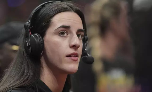 Indiana Fever's Caitlin Clark is interviewed during the second half of a WNBA All-Star basketball game Team Collier, Saturday, July 19, 2025, in Indianapolis. (AP Photo/Michael Conroy)