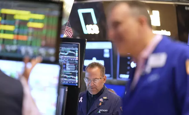 Anthony Matesic works on the floor at the New York Stock Exchange in New York, Wednesday, July 16, 2025. (AP Photo/Seth Wenig)