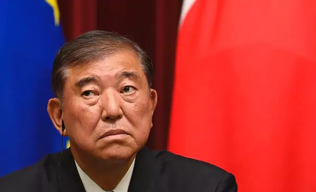 Japanese Prime Minister Shigeru Ishiba attends a join press briefing with European Commission President Ursula von der Leyen and European Council President António Costa after their meeting at the prime minister's office in Tokyo Wednesday, July 23, 2025. (David Mareuil/Pool Photo via AP)