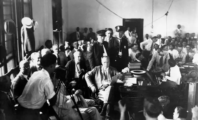 FILE - Judge John T. Raulston of Winchester, Tenn., holds the decision in the Tennessee vs. John Scopes case at the Rhea County Courthouse in Dayton, Tenn., on July 17, 1925. (AP Photo/File)