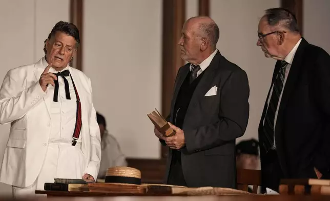 Larry Jones, who portrays William Jennings Bryan, left, rehearses with other actors in the play "Destiny in Dayton", July 8, 2025, in Dayton, Tenn. (AP Photo/Mike Stewart)