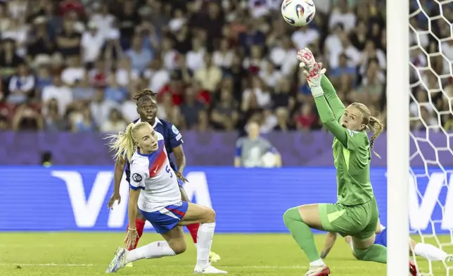 England's goalkeeper Hannah Hampton, right, fails to save a goal by France's Sandy Baltimore, back, next to England's Alex Greenwood, left, during the UEFA Women's EURO 2025 Group D soccer match between France and England at the Letzigrund stadium in Zurich, Switzerland, on Saturday, July 5, 2025. (Michael Buholzer/Keystone via AP)