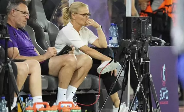 England head coach Sarina Wiegman sits on the bench during the Euro 2025, group D, soccer match between France and England at Stadion Letzigrund in Zurich, Switzerland, Saturday, July 5, 2025. (AP Photo/Martin Meissner)