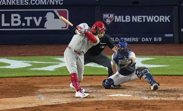 Philadelphia Phillies' Kyle Schwarber hits a two-run home run during the fifth inning of a baseball game against the New York Yankees Friday, July 25, 2025, in New York. (AP Photo/Frank Franklin II)