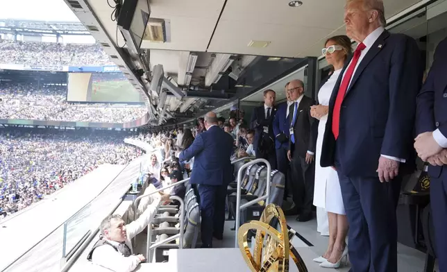 President Donald Trump, right, and first lady Melania Trump attend the Club World Cup final soccer match, at MetLife Stadium in East Rutherford, N.J., Sunday, July 13, 2025. (AP Photo/Jacquelyn Martin)
