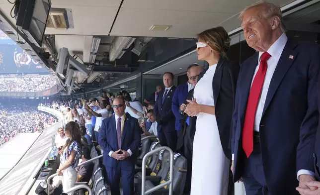 President Donald Trump, right, and first lady Melania Trump attend the Club World Cup final soccer match, at MetLife Stadium in East Rutherford, N.J., Sunday, July 13, 2025. (AP Photo/Jacquelyn Martin)