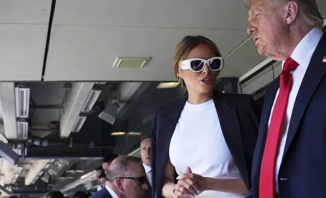 President Donald Trump, right, and first lady Melania Trump attend the Club World Cup final soccer match, at MetLife Stadium in East Rutherford, N.J., Sunday, July 13, 2025. (AP Photo/Jacquelyn Martin)