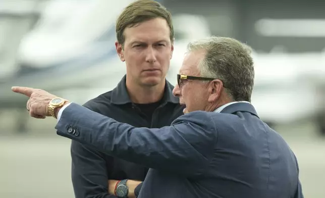 White House special envoy Steve Witkoff, right, and Jared Kushner wait for the arrival of President Donald Trump at Teterboro Airport in Teterboro, N.J., en route to attend the Club World Cup final soccer match, Sunday, July 13, 2025. (AP Photo/Jacquelyn Martin)