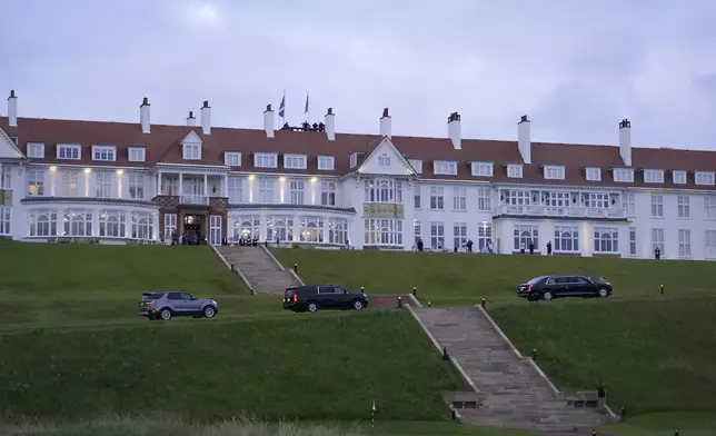 The motorcade with President Donald Trump arrives at the golf course in Turnberry, Scotland, Friday, July 25, 2025.(AP Photo/Jacquelyn Martin)