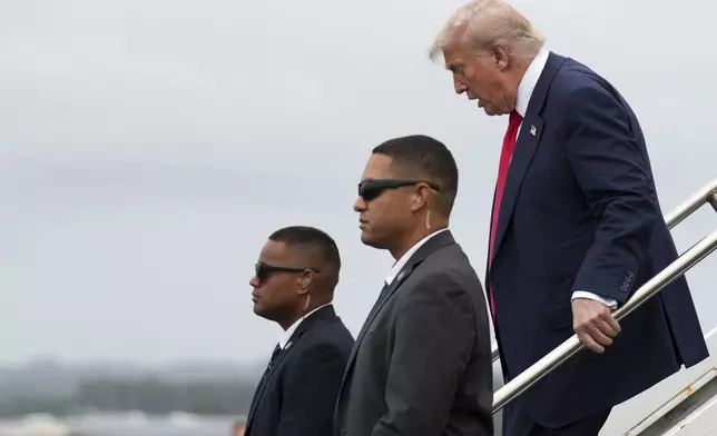 President Donald Trump disembarks from Air Force One as he arrives at Prestwick Airport in Ayrshire, Scotland, Friday, July 25, 2025.(AP Photo/Jacquelyn Martin)