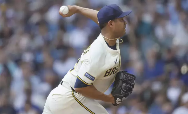 Milwaukee Brewers starting pitcher Jose Quintana throws to the Los Angeles Dodgers during the first inning of a baseball game, Wednesday, July 9, 2025, in Milwaukee. (AP Photo/Jeffrey Phelps)