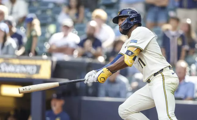 Milwaukee Brewers' Jackson Chourio watches his game-winning single during the 10th inning of a baseball game against the Los Angeles Dodgers, Wednesday, July 9 2025, in Milwaukee. (AP Photo/Jeffrey Phelps)