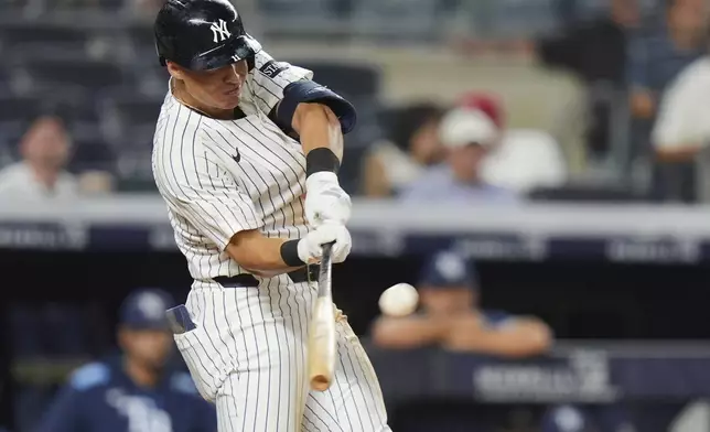 New York Yankees' Anthony Volpe hits a home run during the eighth inning of a baseball game against the Tampa Bay Rays Tuesday, July 29, 2025, in New York. (AP Photo/Frank Franklin II)