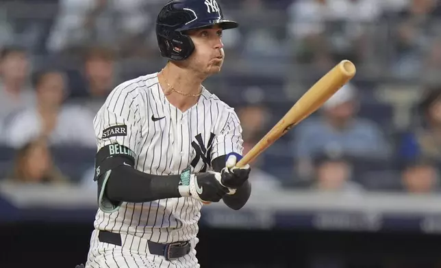 New York Yankees' Cody Bellinger follows through on a three-run home run during the third inning of a baseball game against the Tampa Bay Rays Tuesday, July 29, 2025, in New York. (AP Photo/Frank Franklin II)