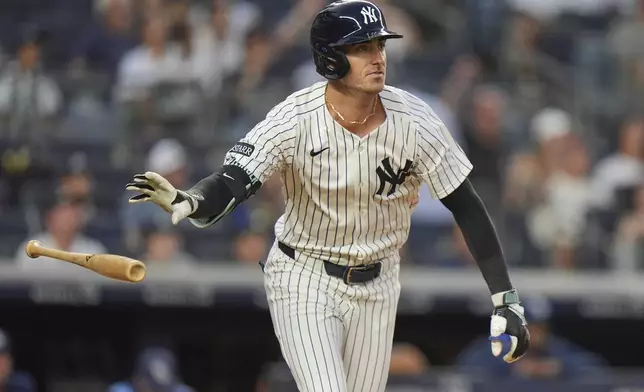 New York Yankees' Cody Bellinger tosses his bat after hitting a three-run home run during the third inning of a baseball game against the Tampa Bay Rays Tuesday, July 29, 2025, in New York. (AP Photo/Frank Franklin II)
