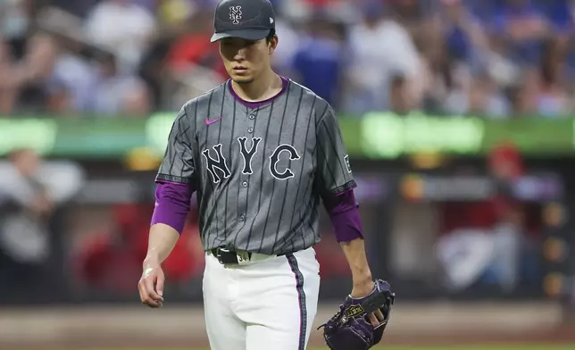 New York Mets pitcher Kodai Senga walks back to the dugout at the end of the third inning of a baseball game against the Los Angeles Angels, Monday, July 21, 2025, in New York. (AP Photo/Heather Khalifa)