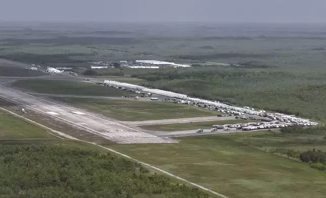This aerial photo shows that the state is plowing ahead with building a an immigration detention facility with heavy-duty tents, trailers and other temporary buildings at the Miami Dade County-owned airfield in the Big Cypress National Preserve, about 45 miles (72 kilometers) west of downtown Miami, This Friday, June 27, 2025. (AP Photo/Daniel Kozin)