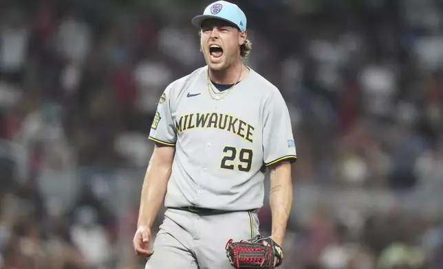 Milwaukee Brewers relief pitcher Trevor Megill (29) reacts after striking out Miami Marlins' Otto Lopez for the final out in the ninth inning of a baseball game, Friday, July 4, 2025, in Miami. (AP Photo/Lynne Sladky)
