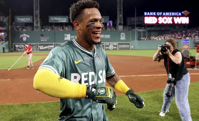 Boston Red Sox's Ceddanne Rafaela reacts after being doused after hitting a two-run walkoff home run during the ninth inning of a baseball game against the Tampa Bay Rays, Friday, July 11, 2025, in Boston. (AP Photo/Mark Stockwell)