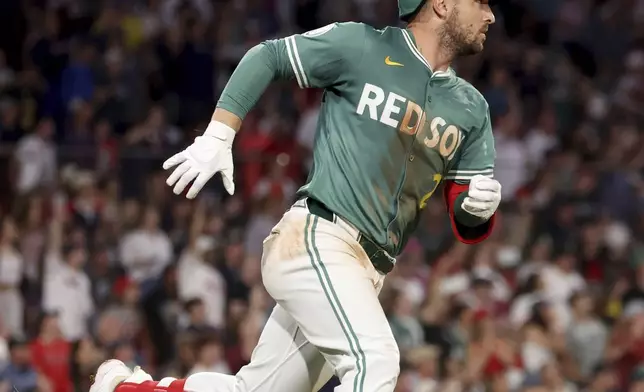 Boston Red Sox's Alex Bregman runs to second base on an infield double during the seventh inning of a baseball game against the Tampa Bay Rays, Friday, July 11, 2025, in Boston. (AP Photo/Mark Stockwell)