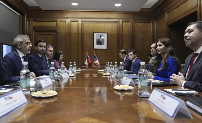 U.S. Homeland Security Secretary Kristi Noem, second from right, meets with Chilean Minister of Public Security Luis Cordero, left, Minister of Justice and Human Rights Jaime Gajardo and acting Attorney General Hector Barros at the Security Ministry in Santiago, Chile, Wednesday, July 30, 2025. (AP Photo/Alex Brandon, Pool)