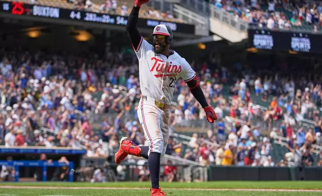 Minnesota Twins' Byron Buxton (25) runs the bases after hitting a solo home run for the cycle during the seventh inning of a baseball game against the Pittsburgh Pirates, Saturday, July 12, 2025, in Minneapolis. (AP Photo/Abbie Parr)
