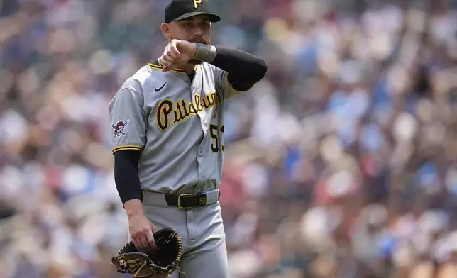 Pittsburgh Pirates starting pitcher Mike Burrows (53) walks back to the dugout during a pitching change in the second inning of a baseball game against the Minnesota Twins, Saturday, July 12, 2025, in Minneapolis. (AP Photo/Abbie Parr)