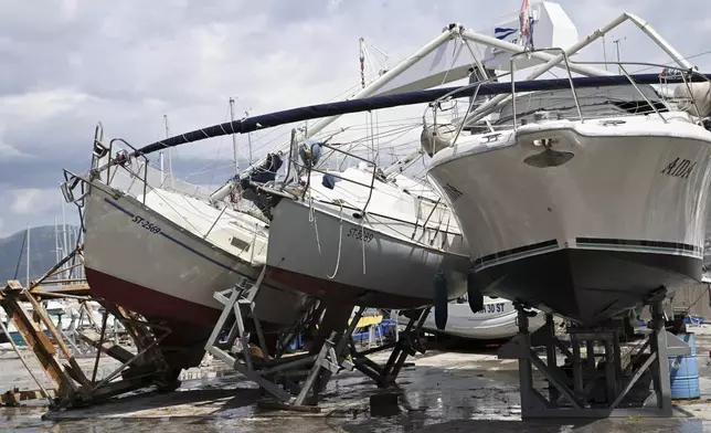 Boats are seen damaged in Split, Croatia, Tuesday, July 8, 2025, following a powerful storm. (AP Photo/Tom Dubravec)