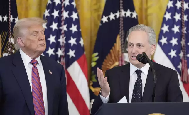 White House AI and crypto czar David Sacks speaks as President Donald Trump listens at an event for the signing of the GENIUS Act, a bill that regulates stablecoins, a type of cryptocurrency, in the East Room of the White House, Friday, July 18, 2025, in Washington. (AP Photo/Alex Brandon)
