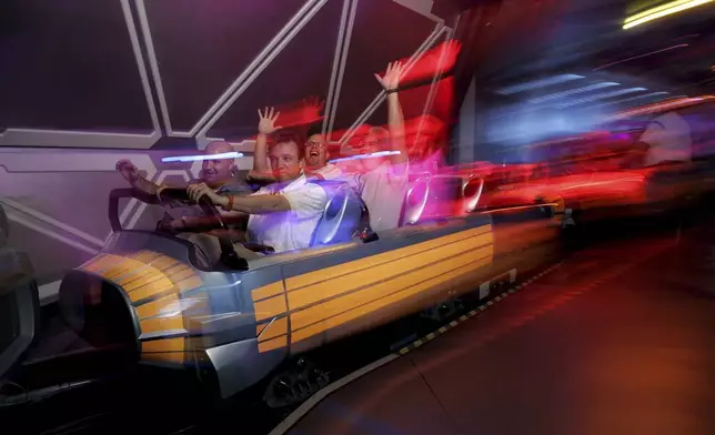 FILE - Guests ride Disneyland's "Space Mountain" attraction in Anaheim, Calif., July 15, 2005. (AP Photo/Kevork Djansezian, File)